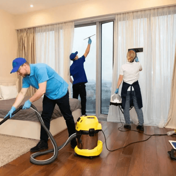 Professional house cleaning service in Chapel Hill NC showing expert cleaner disinfecting kitchen surfaces in a modern residential home